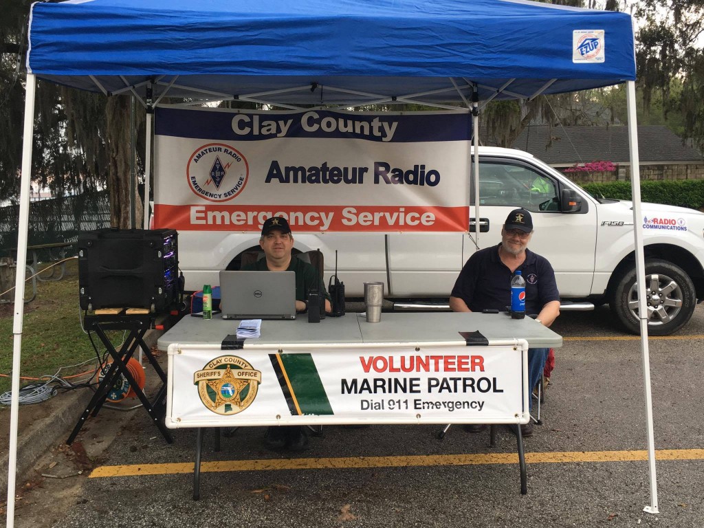 Scott Roberts (KK4ECR) and Jim Schroeder (W1JCS) man the Clay County ARES / CCSO MVP tent at Knights Landing